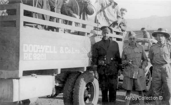 Lt Ron Ashby with Dodwell trucks on the China/Burma border.  
	Photo from the Ashby-Hide collection ©