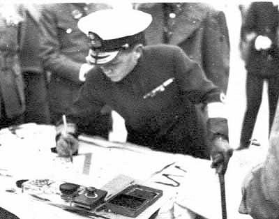 Adm Chan Chak signing documents in Canton